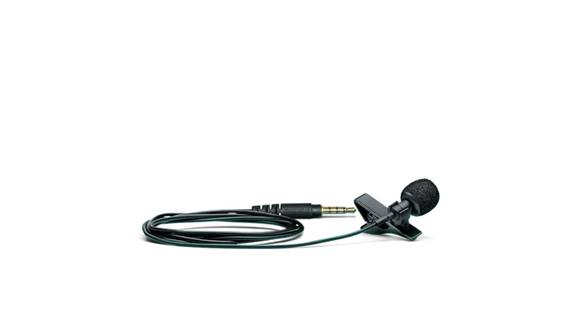 Microfone para celular preto enrolado apoiado em uma superfície branca