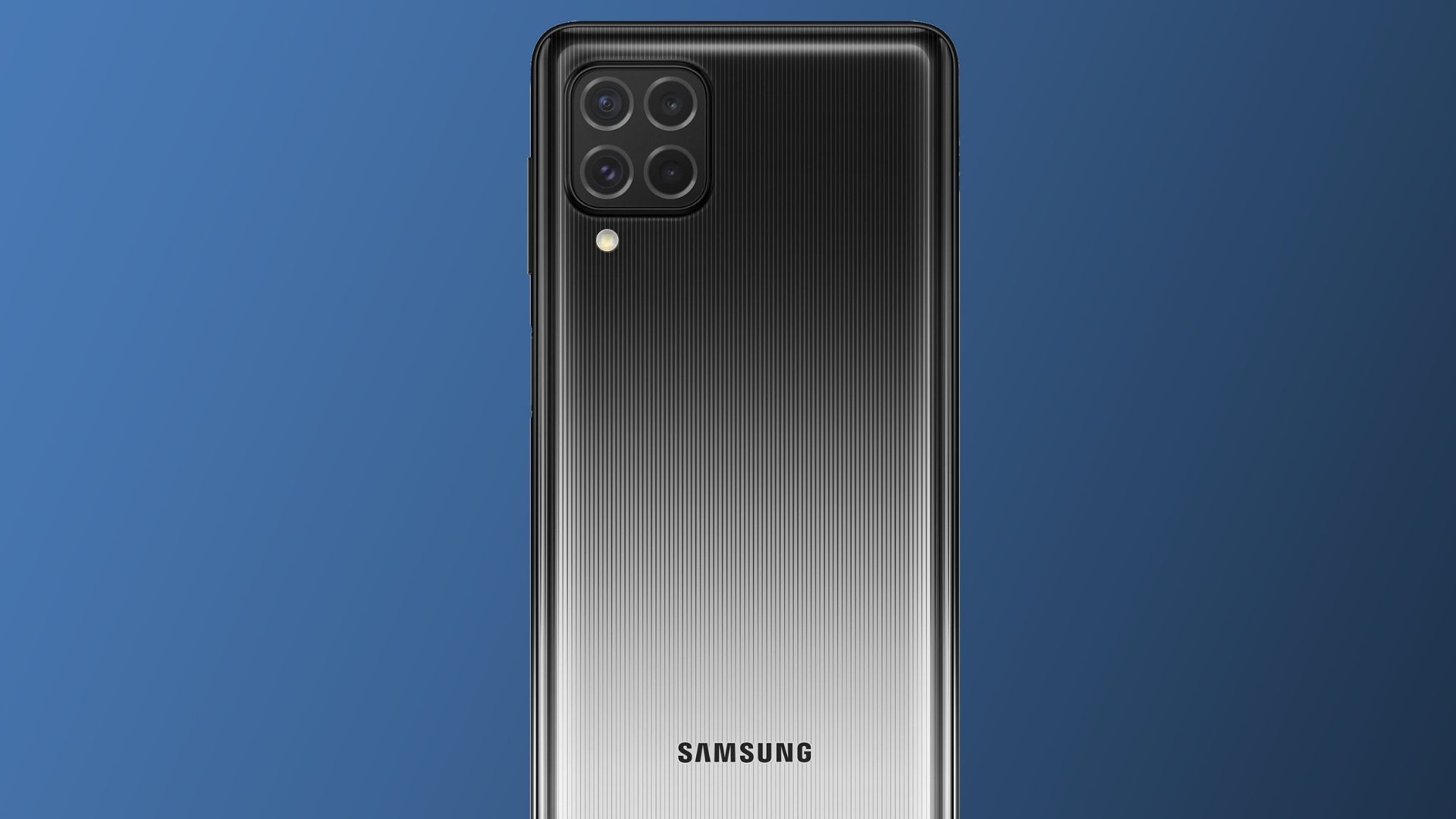 Celular Galaxy M62 com traseira destacada na cor preta e em fundo azul