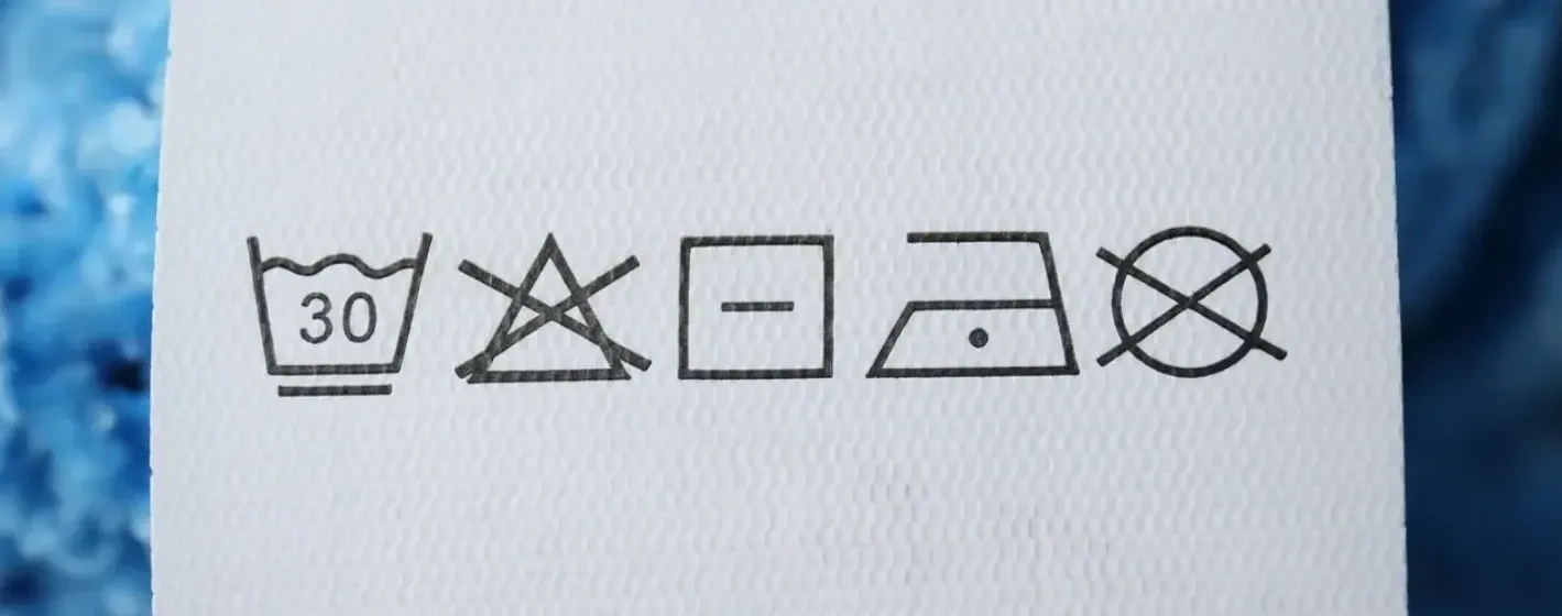 Capa do post: Símbolos de lavagem de roupa: entenda o que cada um significa