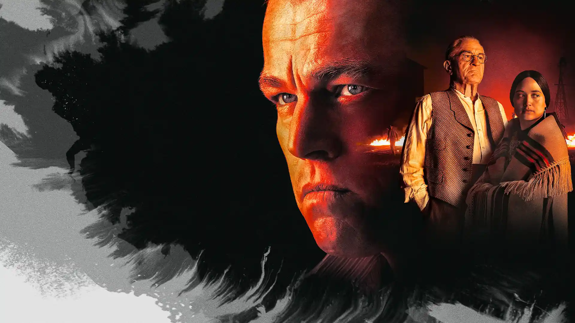 Homem olhando sério para um lado com o rosto avermelhado e do outro lado homem em pé também sério em tom avermelhado, enquanto ao redor de ambos o fundo é cinza  