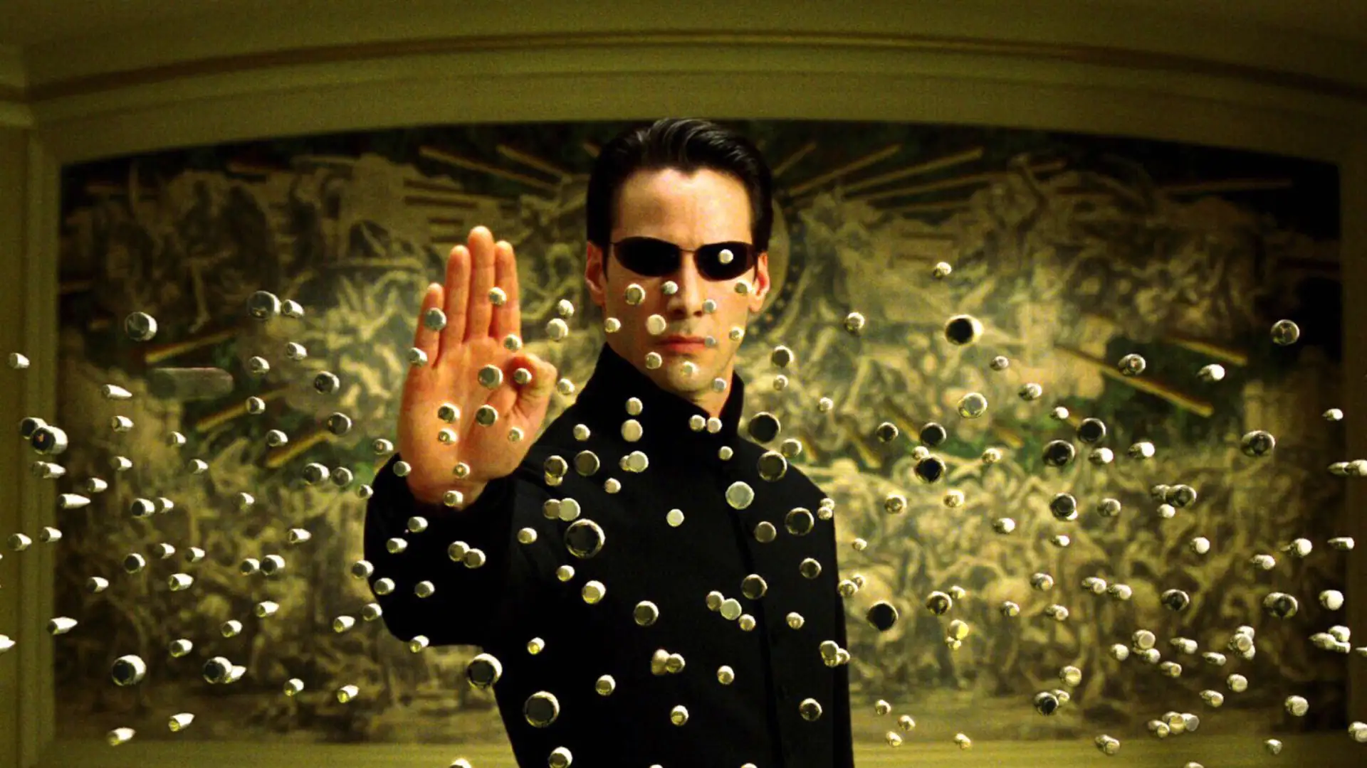 Personagem de Keanu Reeves parando balas com a própria mão