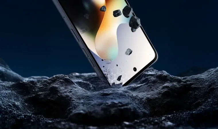 Um celular está com a ponta sobre um pedaço de pedra 