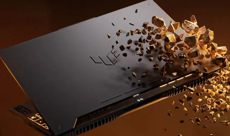 Imagem do notebook ASUS TUF GAMING F15 semiaberto quebrando uma pedra com sua ponta em vários fragmentos 