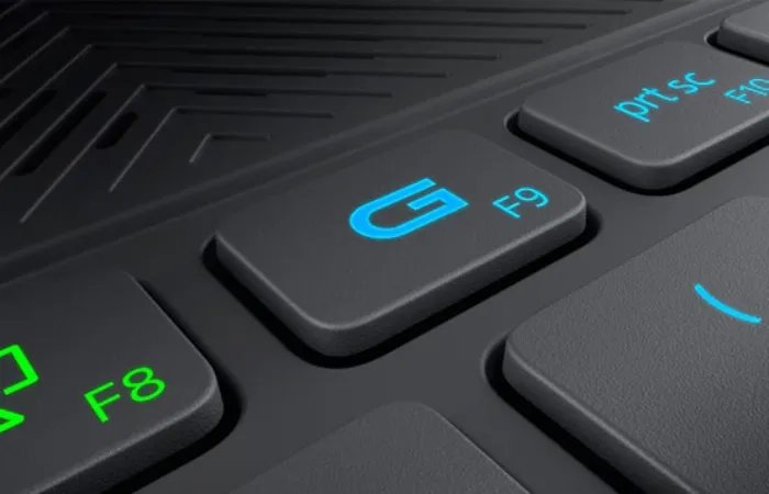Imagem aproximada do teclado mostrando a tecla do Game Shift com uma grande letra "G" no centro e a função F9 menor ao lado inferior direito
