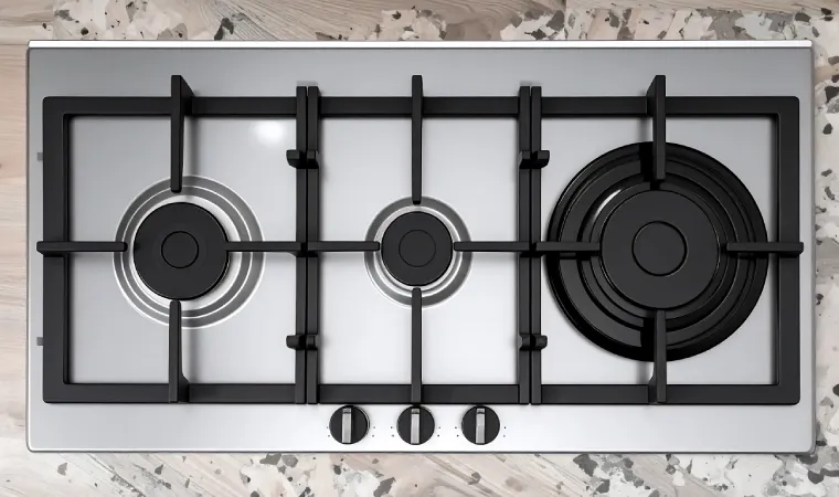 Cooktop inox 3 bocas instalado em uma bancada.