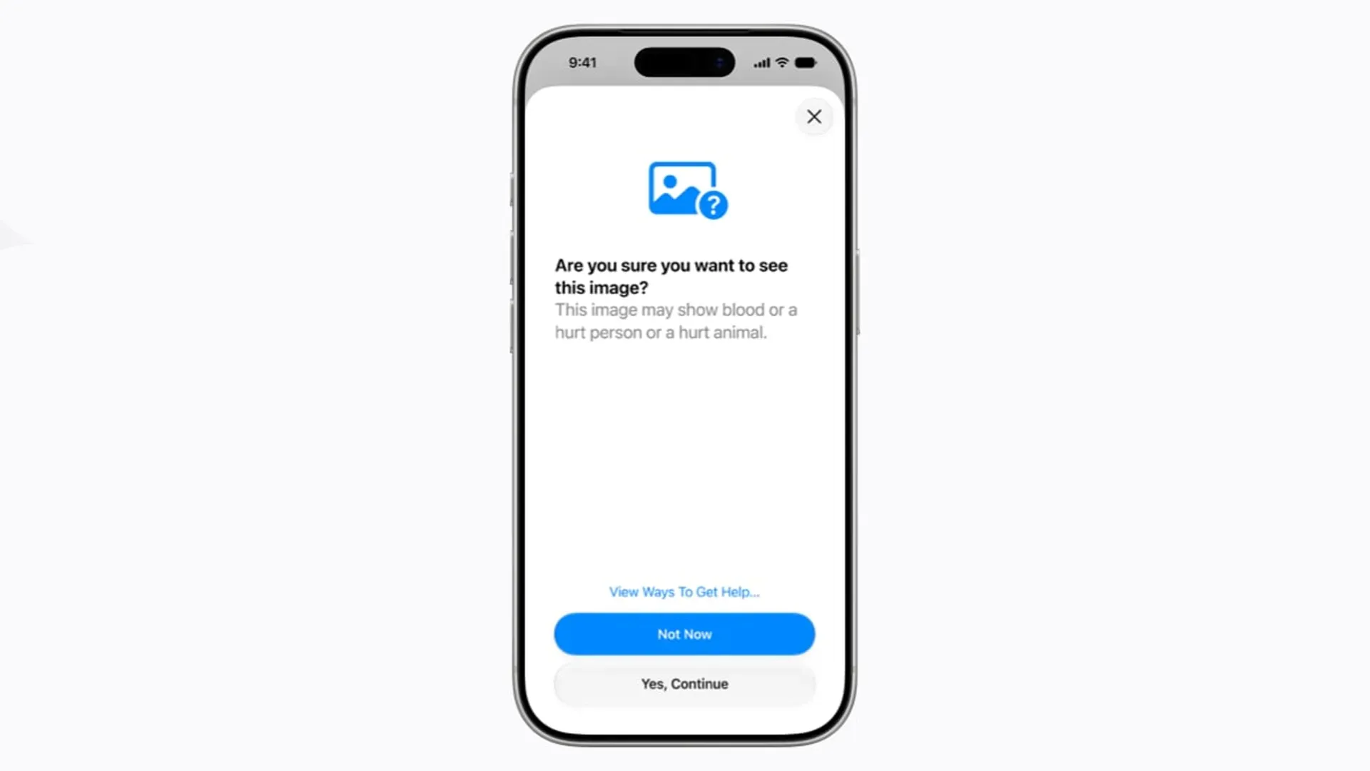 Tela de iPhone com aviso de Segurança de Comunicação perguntando ao usuário se deseja ver imagem com possível conteúdo violento, com opções de recusar ou continuar 