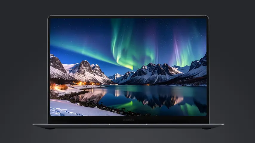 Galaxy Book6 Pro exibe aurora boreal sobre montanhas nevadas em tela de bordas finas.